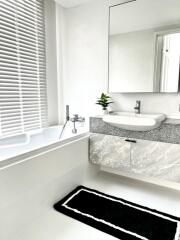 Modern bathroom with tub and sink