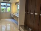 Spacious bathroom with lockers and double sinks