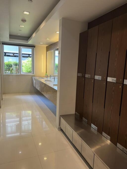 Spacious bathroom with lockers and double sinks