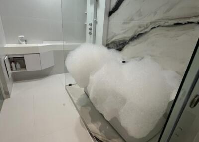 Modern bathroom with marble finish and bubble bath