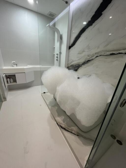 Modern bathroom with marble finish and bubble bath