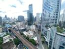 City skyline view with tall buildings and railway