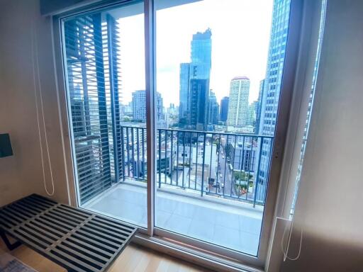 City view from the living area with sliding glass doors