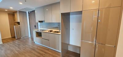 Modern kitchen with integrated appliances and wooden flooring