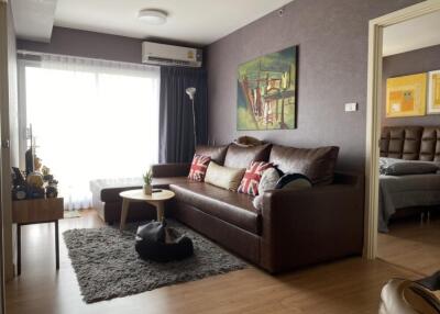 Cozy living room with modern decor and brown couch