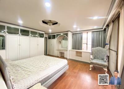 Spacious bedroom with built-in closets and dressing area