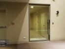 Entrance to a residential building with hallway doors and an emergency exit