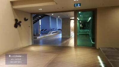 Lobby area with view of a modern indoor pool