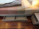 bed with storage drawers and nightstand