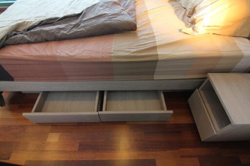 bed with storage drawers and nightstand