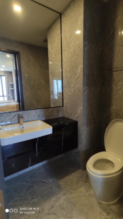 Modern bathroom with large mirror and sink