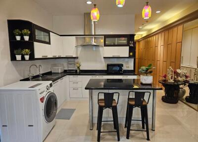 Modern kitchen with appliances and dining area