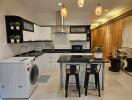 Modern kitchen with appliances and dining area