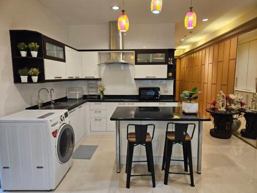 Modern kitchen with appliances and dining area