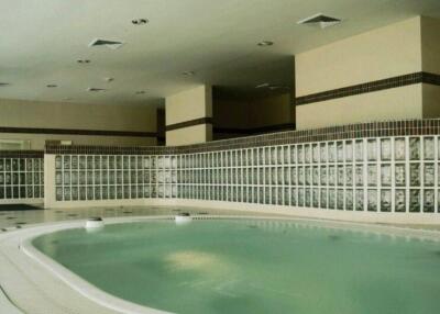 Indoor pool area with jacuzzi