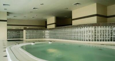 Indoor pool area with jacuzzi