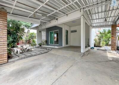 Covered outdoor area with seating and garden