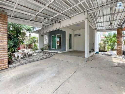 Covered outdoor area with seating and garden