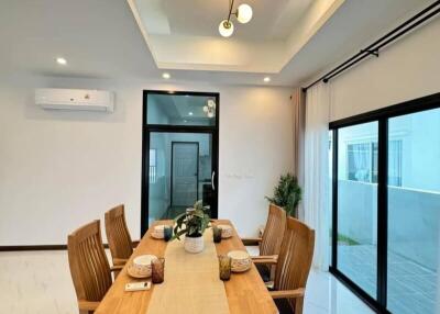 Modern dining room with wooden table and chairs