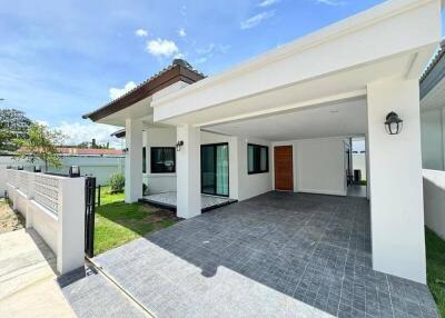 Modern single-story house with covered carport