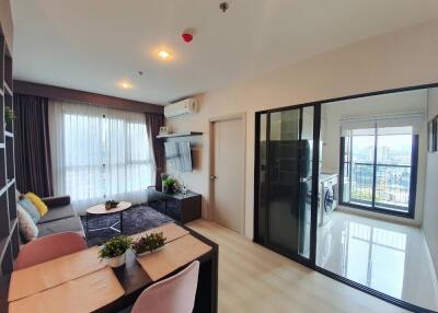 Modern living room with dining area and laundry room