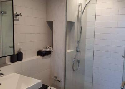 Modern bathroom with glass shower enclosure and sink