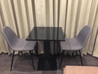 Small dining area with a table and two chairs