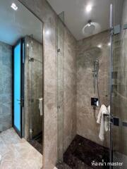 Modern bathroom with spacious shower area and contemporary fixtures