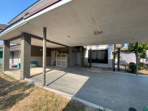 Exterior view of a residential property with carport