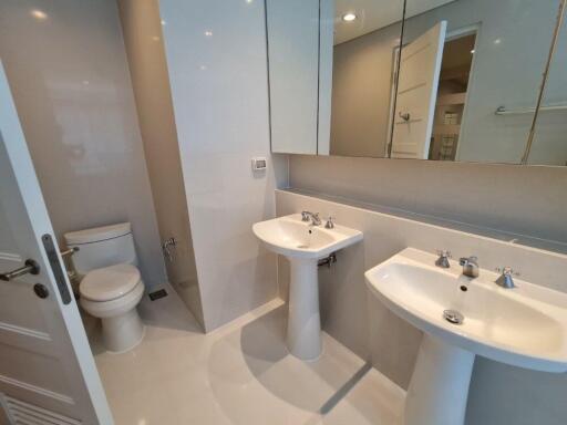 Bathroom with dual sinks and large mirrors