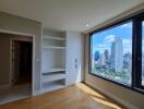 Bedroom with large window and city view