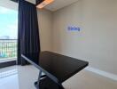 Modern dining area with sleek black table and stylish lighting