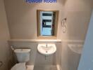 Powder Room with white fixtures and mirror