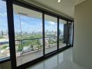 Spacious balcony with large windows and city view