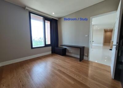 Bedroom with large window and study area