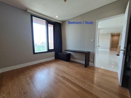 Bedroom with large window and study area