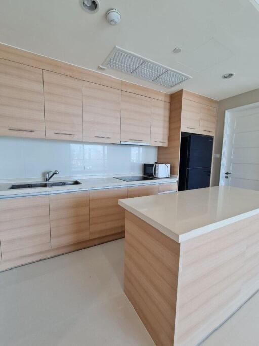 Modern kitchen with wood cabinets and island