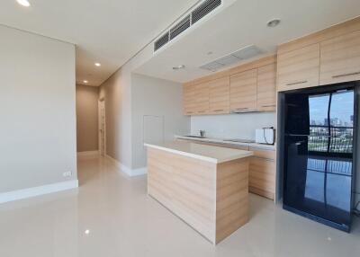 Modern kitchen with wooden cabinets and a view