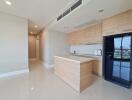 Modern kitchen with wooden cabinets and a view