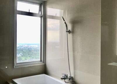 Modern bathroom with bathtub and window