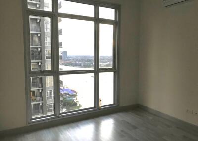 Bedroom with large window and city view