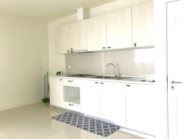 Modern white kitchen with cabinets and sink