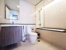 Modern bathroom with sink, toilet, and bathtub