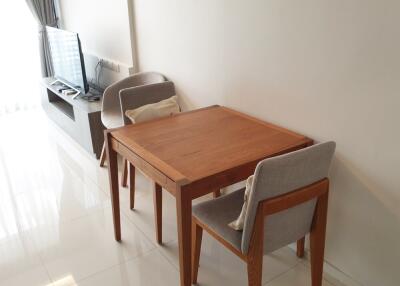 Living room with a dining table and TV