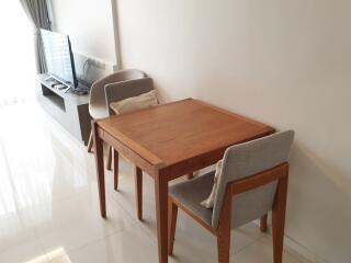 Living room with a dining table and TV