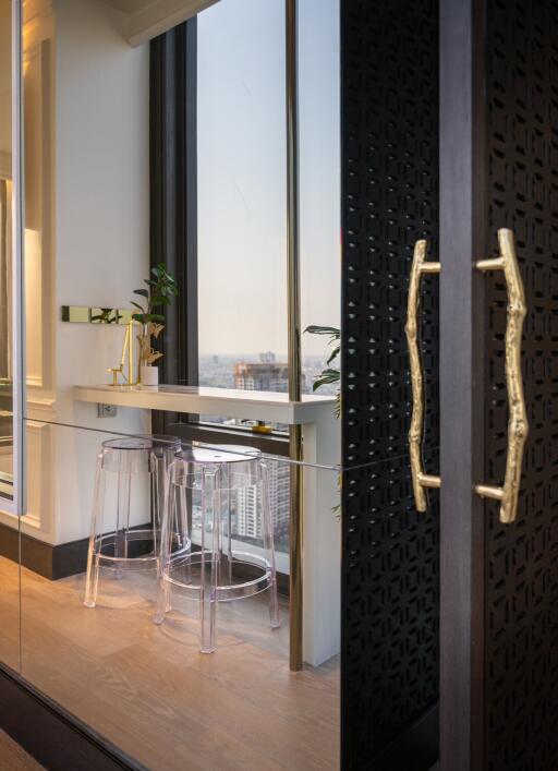 Modern kitchen with bar stools and large window