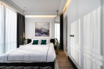 A stylish and modern bedroom with a large bed and contemporary decor