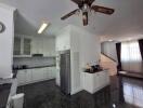 Modern kitchen with white cabinetry and stainless steel appliances