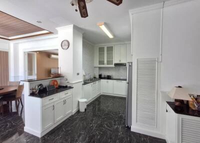 Spacious modern kitchen with adjacent dining area