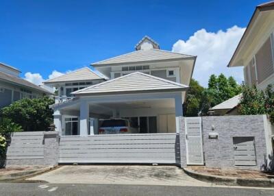 Exterior view of a modern house with a carport